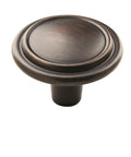 Traditional Round Cabinet Knob In Oil Rubbed Bronze Finish With Subtle Copper Highlights Adds Warm Elegance To Drawers Or Furniture.
