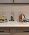Kitchen countertop with decor and cabinets featuring 30 Pack Solid 5 Inch Cabinet Handles Matte Black Pulls For Kitchen Drawers And Cabinets.