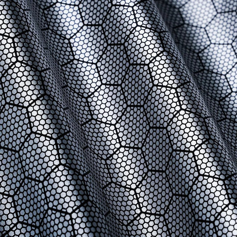 Close-up of VION R1S roof sunshade fabric in black with hex honeycomb mesh pattern
