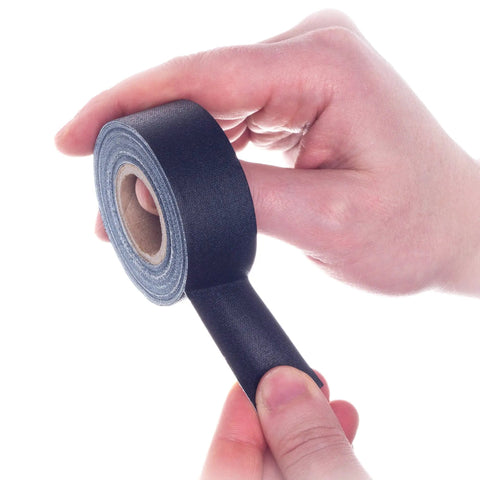Pro Grade Black Gaffer Tape Rolls 1 Inch By 8 Yards Pack Of 4 Made In USA in hand, showing tear by hand feature
