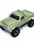 Badass 1/18 Scale RC Crawler With Slick Shifting Two Speed Transmission And Bulletproof Metal Gears Nasty Terrain Rock Climbing Rig Trail Smashin Setup Drop In Ready Convoy Medium Olive Green from above showing chrome details and large tires.