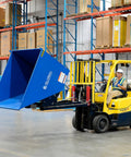 Super Top Notch Heavy Duty Steel Self Dumping Forklift Hopper with Straight Up Bump Release in use, lifting waste in warehouse.