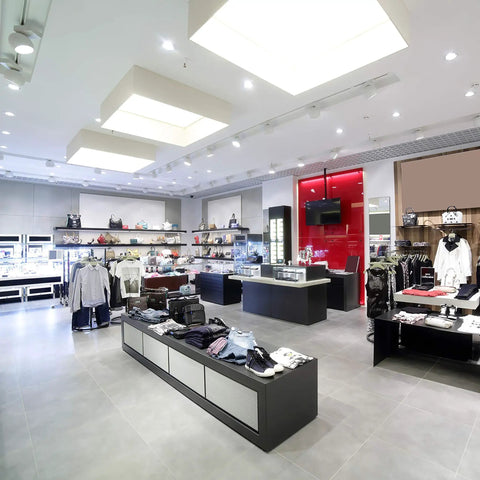 Interior of modern retail store with clothing and display cases