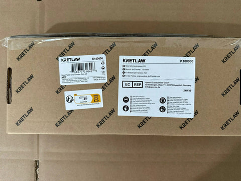 Front view of brown cardboard box for KRETLAW mini grease gun with barcode label.