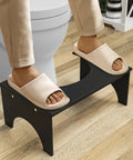 Person using 7 Inch Bamboo Toilet Stool For Adults And Kids Poop Stool For Bathroom Use Relieves Bowel Pressure Eases Defecation Anti Slip Grippy Surface Easy Clean Black