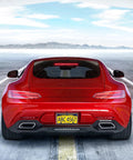Rear view of a red car showcasing the Top Shelf Real Carbon Fiber License Plate Frame With Heavy Duty Stainless Steel Core And High Gloss UV Coating.