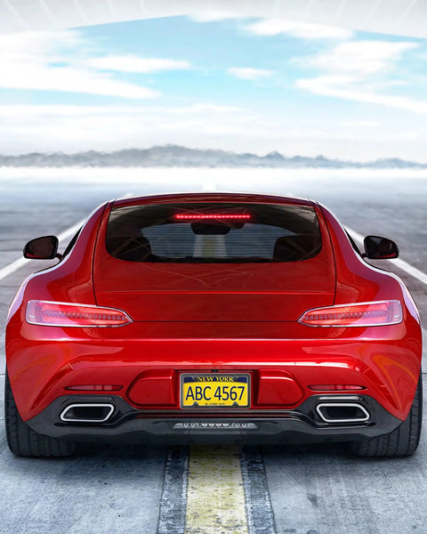 Rear view of a red car showcasing the Top Shelf Real Carbon Fiber License Plate Frame With Heavy Duty Stainless Steel Core And High Gloss UV Coating.