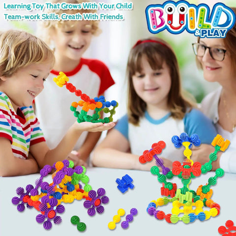 Children playing with Kid Friendly STEM Building Blocks Set 120 Piece Gear Interlocking Toy Kit With Colorful Star Shaped Pieces Safe Plastic Material For Toddlers Aged 3 Plus Educational Construction Toy For Boys And Girls.