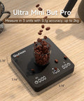Game Changing Digital Coffee Scale With 2 Kg Capacity And 0.1g Precision, showing display with coffee beans on top.
