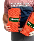 Golfer holding collapsible Chipping Plate Training Tool for a killer short game balance and weight shift improvement on the green.