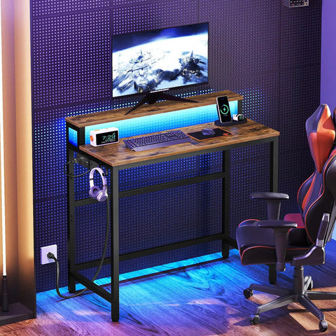 Small Computer Desk With Charging Station And LED Lights, Gaming Desk With Monitor Stand, in Rustic Brown with chair