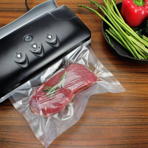 Bang For Your Buck Vacuum Sealer Bags Rolls 4 Pack 11 Inch By 25 Feet Compatible With FoodSaver in use with red meat inside