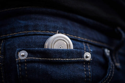 Ultra Tiny Titanium Ti Tape Retractable Mini Tape Measure With 3 Feet Range, Imperial And Metric, in jeans pocket, stonewashed