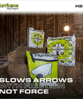 Two Sided Archery Bag Target Built For 425 FPS Practice with bright aiming points on hay bales in rustic barn setting.