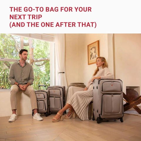 Two people sitting with Softside Expandable Checked Luggage for Long Trips with 360 Spinner Wheels and Retractable Handle, 29-inch suitcase.