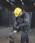 Worker using an 18V Cordless Driver Drill Kit Handles Heavy Demands With Two 18V 5.5Ah Batteries And A Badass Tool Free Quick Change Chuck.