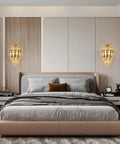 Modern K9 Crystal Wall Sconce With Gold Finish Luxury Bedroom Wall Light elegantly mounted above bed on both sides