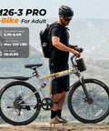 Man standing with Foldable Electric Bike For Adults With 750W Peak Motor And 48V Battery 50 Miles, in a scenic outdoor setting.