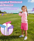 Child playing with Kids Golf Toy Set With Dinosaur Automatic Ball Return LED Light Up Night Balls 3 Clubs Putting Mat