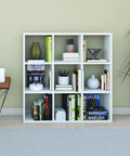 DIY Cube Organizer Shelf With Nine Cubes For Bedroom Living Room And Home Office In White Made In USA Easy To Assemble Sturdy Modular Storage For Books Decor And Plants displayed in room.