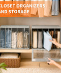 Four Pack Gray Closet Organizers And Storage Bins Heavy Duty Fabric Wardrobe Dividers with folded sweaters and pants.