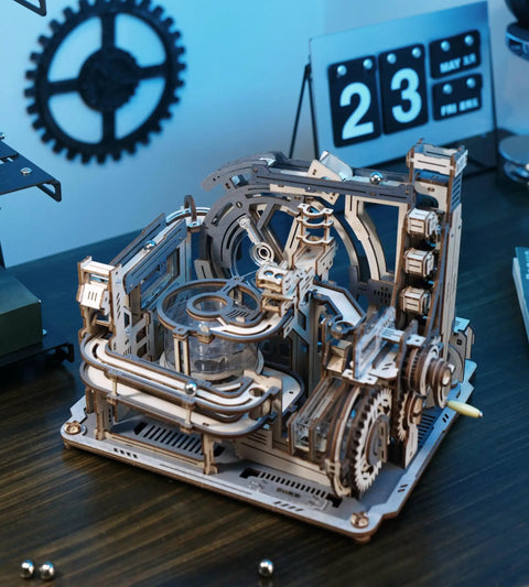Motorized Wooden Marble Run Puzzle For Adults LGC01 Marble Spaceport 3D STEM Toy on desk with gears and calendar