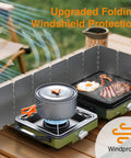Two Burner Camping Stove With Windshield 20000 BTU Propane Camp Stove Portable Folding Gas Stove Includes Frying Pan Coffee Stand And Carry Bag Green Bundle with pot and cooking food in windproof setup.