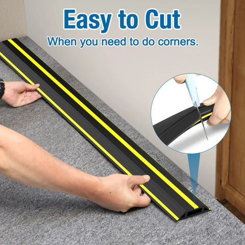 10 Foot Floor Cable Cover Protector Pro Grade Heavy Duty PVC Duct being cut for easy routing, demonstrating flexibility and safety.