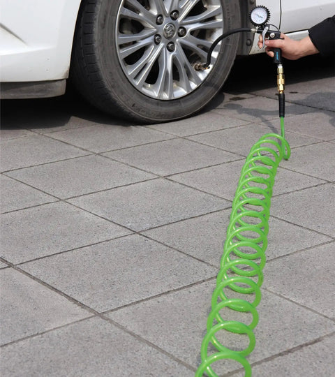 Kickass Polyurethane Recoil Air Compressor Hose 1/4 Inch By 50 Feet in use with tire pressure gauge on a car wheel.