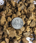 Decomposed Granite For Pathways And Patios, 40 lb bag shown with US quarter for scale, compactable DG gravel with multicolor tones.