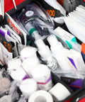 Close-up of Large EMT Trauma Kit For First Responders, fully stocked with supplies for CPR, airway, bleeding, wounds in red bag.