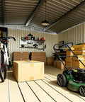 Interior of Heavy Duty 10 By 14 Ft Outdoor Metal Storage Shed With Waterproof Construction Lockable Double Hinged Door, storing lawn mower, bike, boxes, and tools.