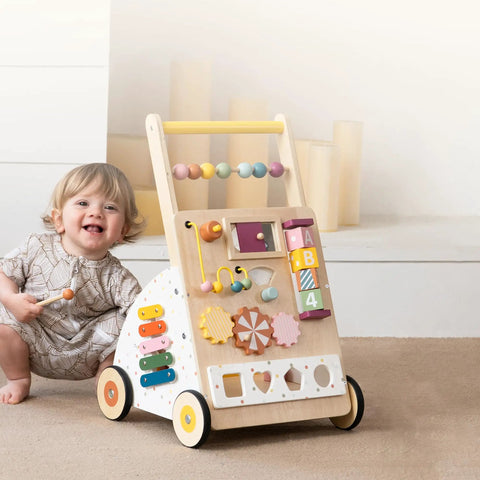 Flat Out Favorite For Little Kiddos With This Wooden Baby Walker Activity Center with colorful modules and wooden wheels.