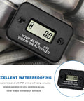 Vibration Activated Hour Meter for Motorcycles, Generators, and Compressors, Waterproof Digital LCD Time Counter with Maintenance Reminder, Tiny Durable Gauge for Service Intervals and Wear Tracking. Black ABS hour meter mounted on equipment, IP68 waterproof.