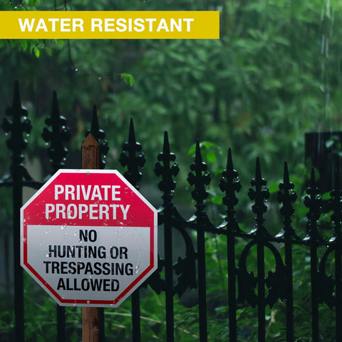 Tough As Nails 6 Pack 12 Inch Rustproof Aluminum Weather Resistant No Hunting Or Trespassing Signs positioned on a wooden post.