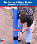 Person applying Black Butyl Waterproof Repair Tape For Roof Patches And Leaks, Heavy Duty Weatherproof Sealant Tape to a blue post