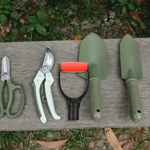 Grip Shovel Handle Replacement 2 Pack D Style Handles Easy Install For Garden Shovels on a wooden bench with garden tools.