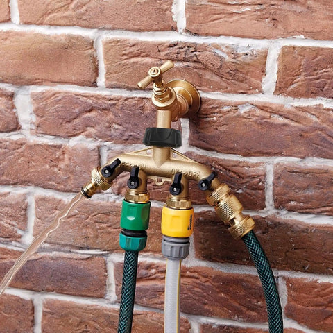 4 Way Heavy Duty Brass Garden Hose Splitter For 3/4 Inch Hoses, No Nonsense Water Faucet Splitter With 4 Valves, Rubber Washers And Teflon Tape, Arthritis Friendly Top Connection, Built Tough Yard Hose Connector For Quick Setup installed on brick wall