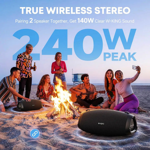Outdoor beach party with Monster Bass 120W Outdoor Bluetooth Speaker Boombox, surrounded by people near a campfire, at sunset.