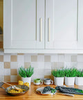 Modern kitchen with white cabinets featuring 25 Pack Solid 7.5 Inch Kitchen Square Cabinet Handles Brushed Nickel Pulls