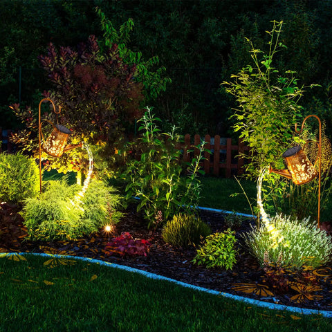 Solar Watering Can Lantern With Butterfly LED Lights waterproof hanging garden decor illuminating a yard with vivid patterns