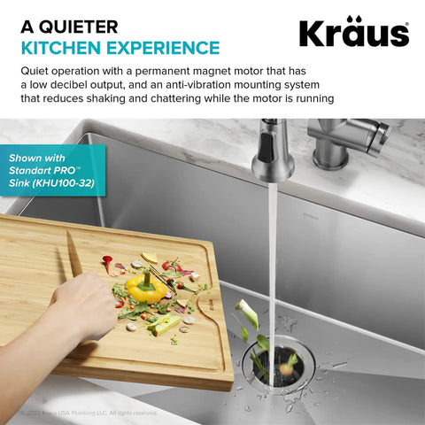 Hand scraping food into 1/2-Horsepower Continuous-Feed Garbage Disposal With Ultra-Quiet Motor, Quick-Connect Mount installed in sink