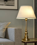 Spyglass Table Lamp With Antique Brass Finish Dope Retro Modern Classic Vibe Linen Shade 30.5 Inch Tall in living room