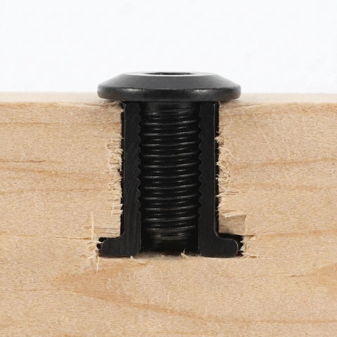 Metal fastener from 40 Piece Furniture Connector Set With Hex Head Bolts And Dowel Barrel Nuts for quick DIY assembly in wood panel close-up.
