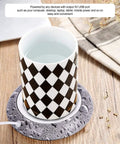 Smart Usb Coffee Mug Warmer And Electric Beverage Heater For Desk Use with a checkered cup on a mat, maintaining drink temperature.