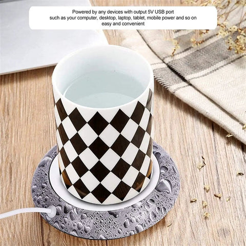 Smart Usb Coffee Mug Warmer And Electric Beverage Heater For Desk Use with a checkered cup on a mat, maintaining drink temperature.