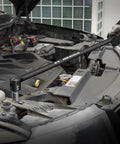 Rugged 24 Inch Breaker Bar Featuring 240 Degree Flex Head And Half Inch Square Drive in use on a vehicle engine.