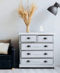 White dresser with 30 Pack 3 Inch Flat Black Drawer Pulls and modern decor, featuring cabinet cup pulls for kitchen makeovers.