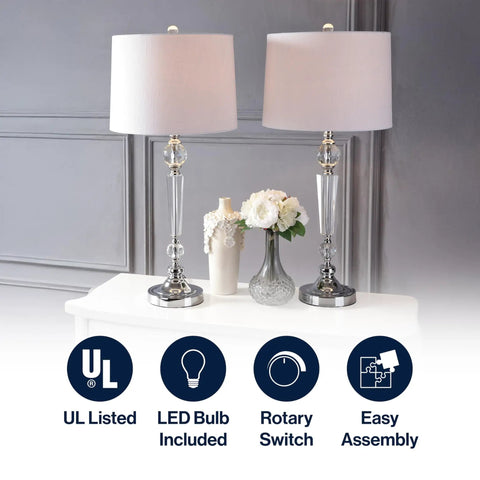 Clear Crystal Table Lamp Set Of 2, 29 And A Half Inch Tall Modern Glam Candlestick Lamps With Chrome Bases And White Linen Drum Shades, LED Bulbs Included For Living Room Or Bedroom, displayed on a table with flowers.