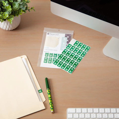 2026 Year Labels 250 Pack Green Color Code File Folder Labels With Wraparound End Tab Design Durable Laminated on a desk
